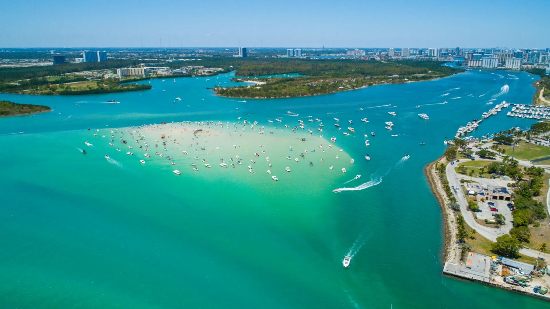 Haulover Sandbar in Miami with boats in shallow turquoise water
